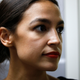 New York Democrat candidate for Congress Alexandria Ocasio-Cortez listens to Michigan Democratic gubernatorial candidate Abdul El-Sayed speak at a press availability after a campaign rally the two held on the campus of Wayne State University July 28, 2018 in Detroit, Michigan.